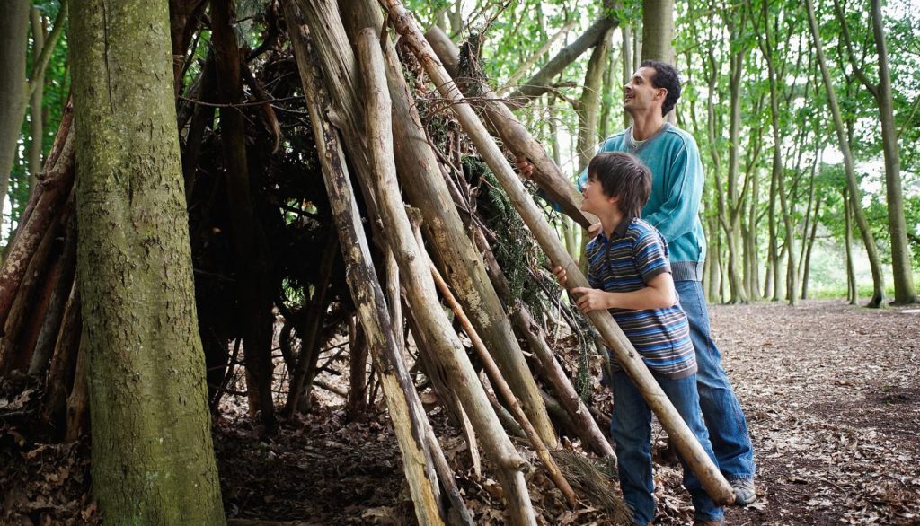 dad and boy building den